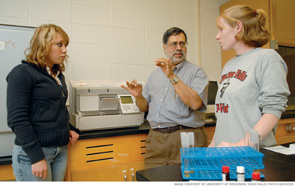 Purnendu Vasavada, PhD (center), instructs students in a food microbiology lab at the University of Wisconsin, River Falls.